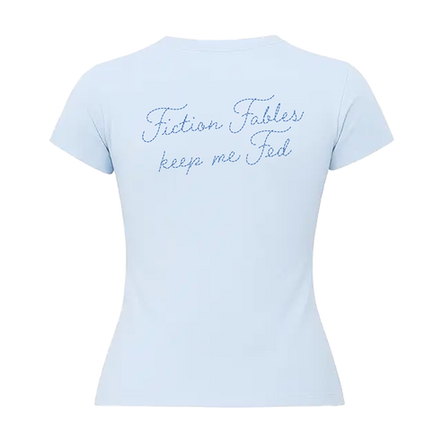 A light blue short-sleeve baby t-shirt shown from the back, featuring the phrase 'Fiction Fables keep me Fed' printed in a blue cursive script across the upper back.