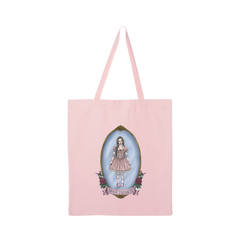 A light pink canvas tote bag with long shoulder straps, featuring a central graphic of a doll in a pink dress inside an oval frame with the text 'Mollie Elizabeth'.
